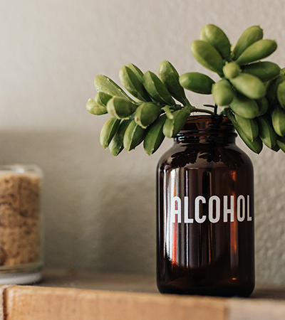 Pure Health Alliance, Image of bottle with succulent in it.