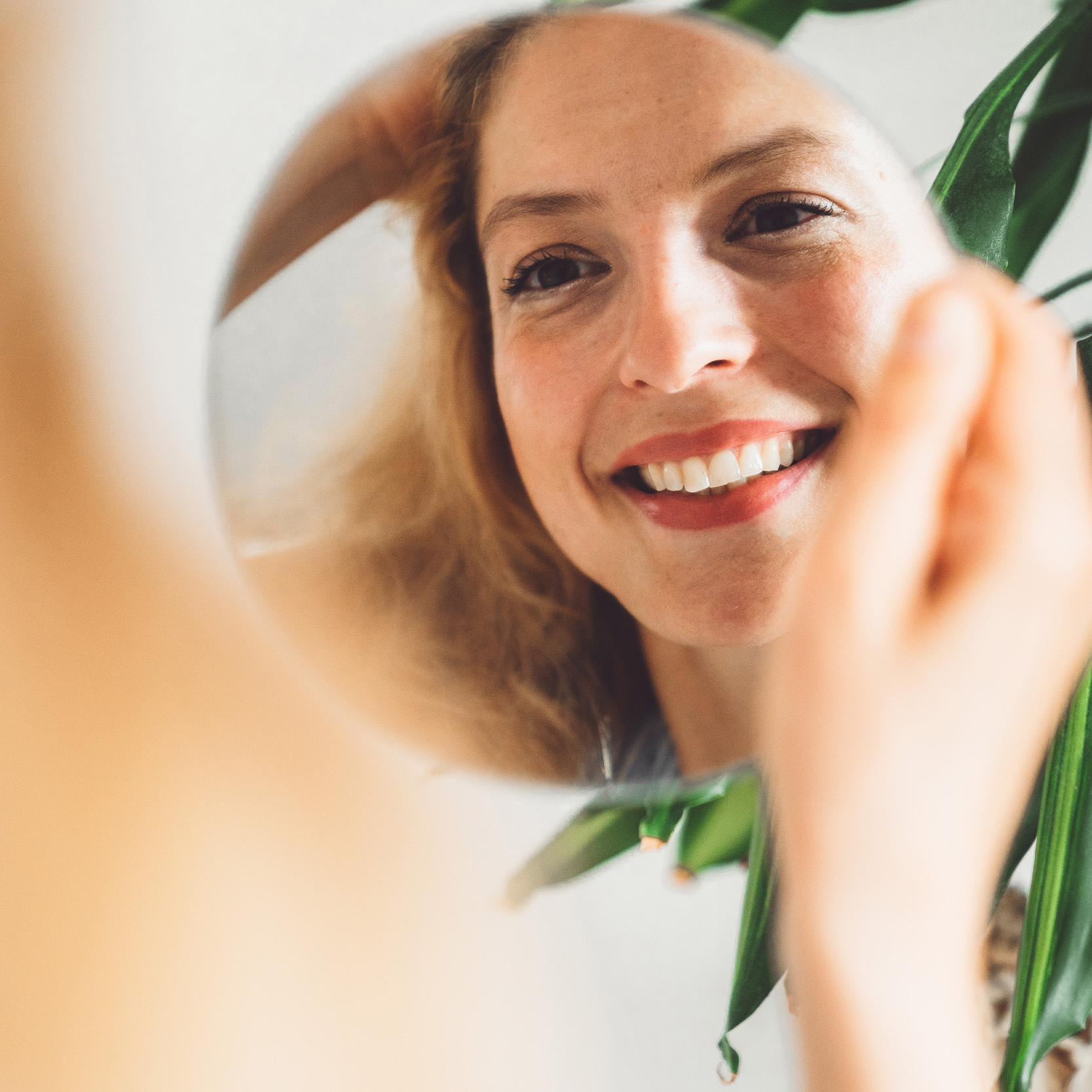 acupuncture facial rejuvenation, image of a woman getting acupuncture facial rejuvenation and smiling.